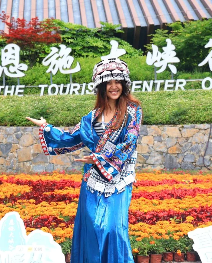 Renata in traditional dress during a cultural visit in Enshi, Hubei