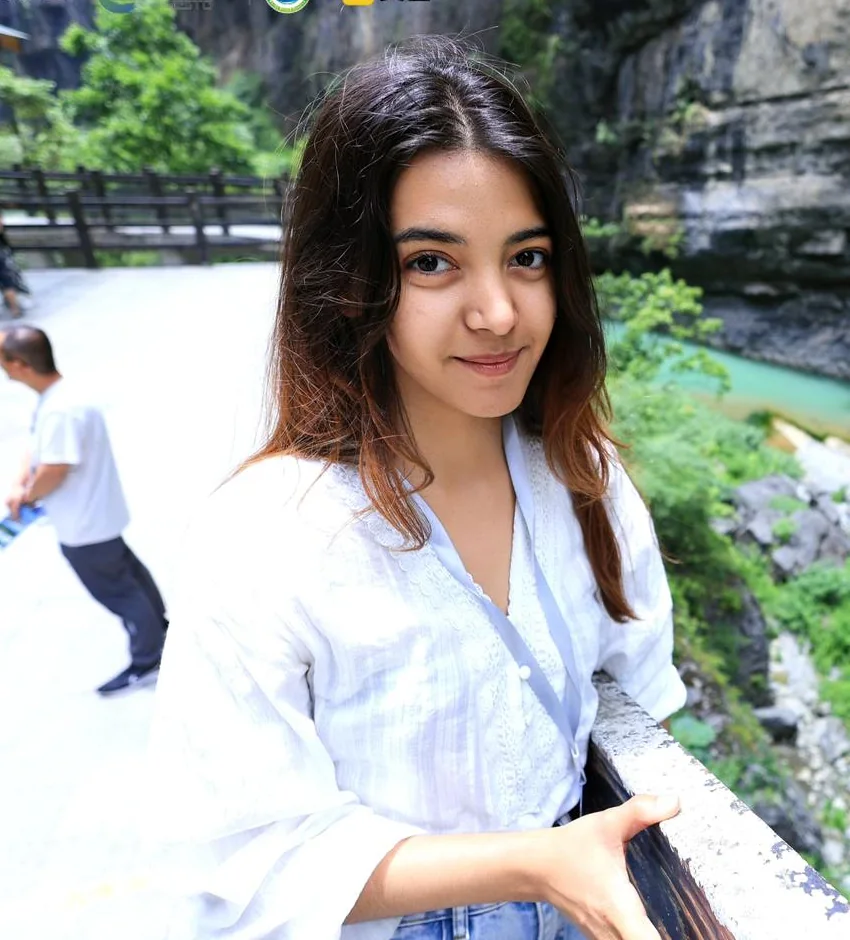 Renata outdoors by a river gorge in Hubei, China